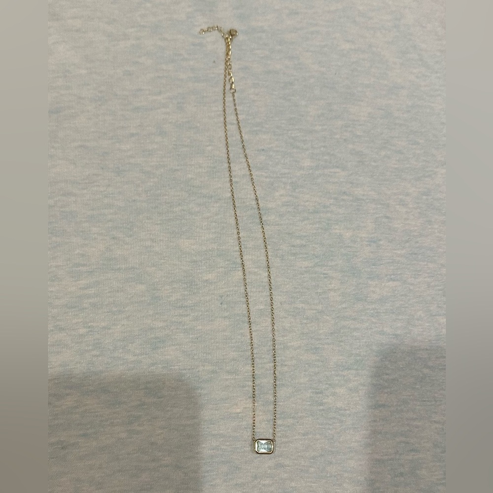 Gold light blue crystal necklace.